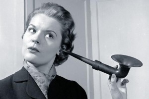young-woman-holding-ear-trumpet-black-and-white